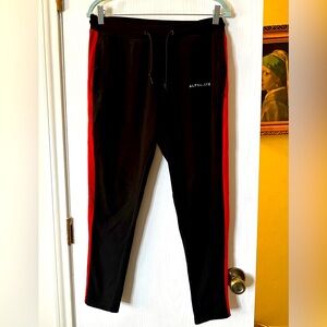 Alphalete training pants, joggers, black with double stripe. Men’s size small